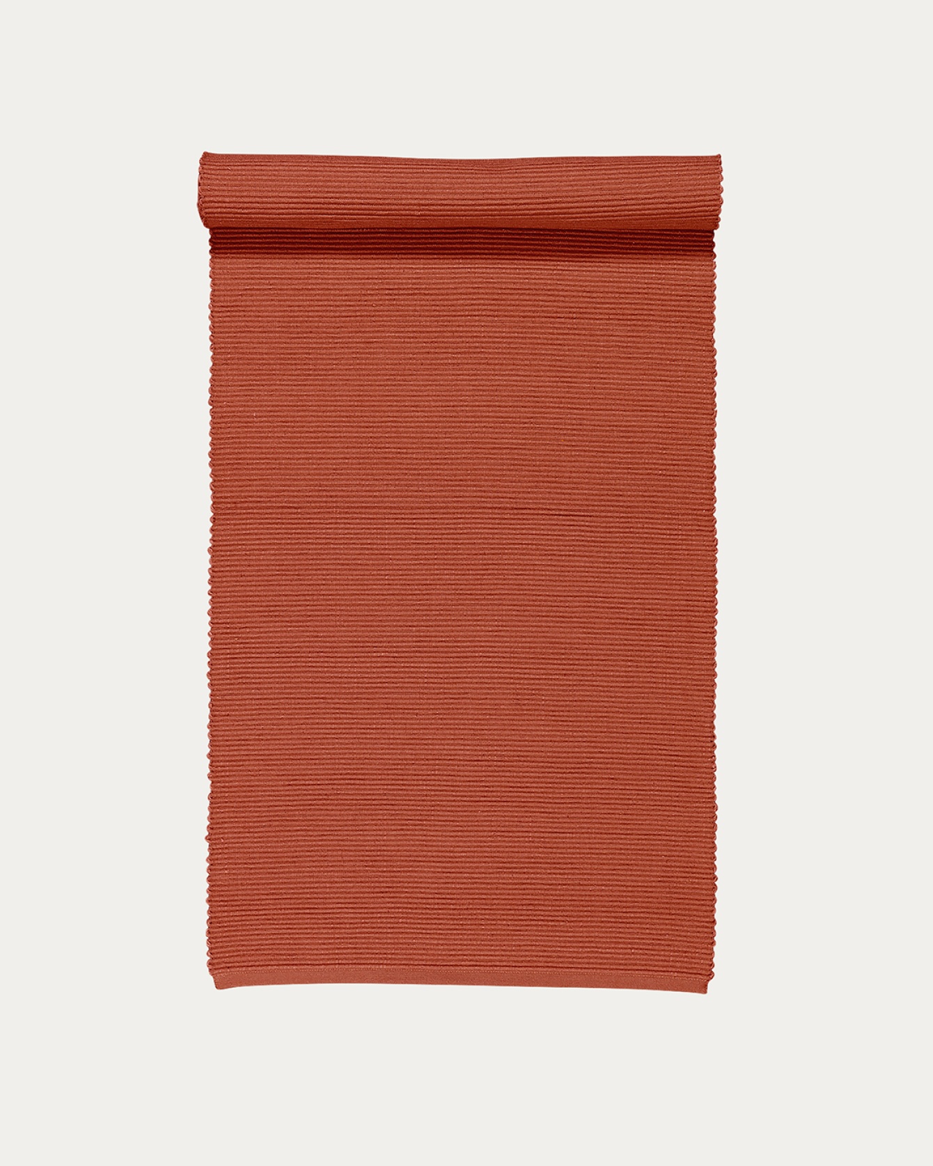 Image du produit chemin de table UNI orange rouillé en coton doux de qualité côtelée de LINUM DESIGN. Taille 45 x 150 cm.