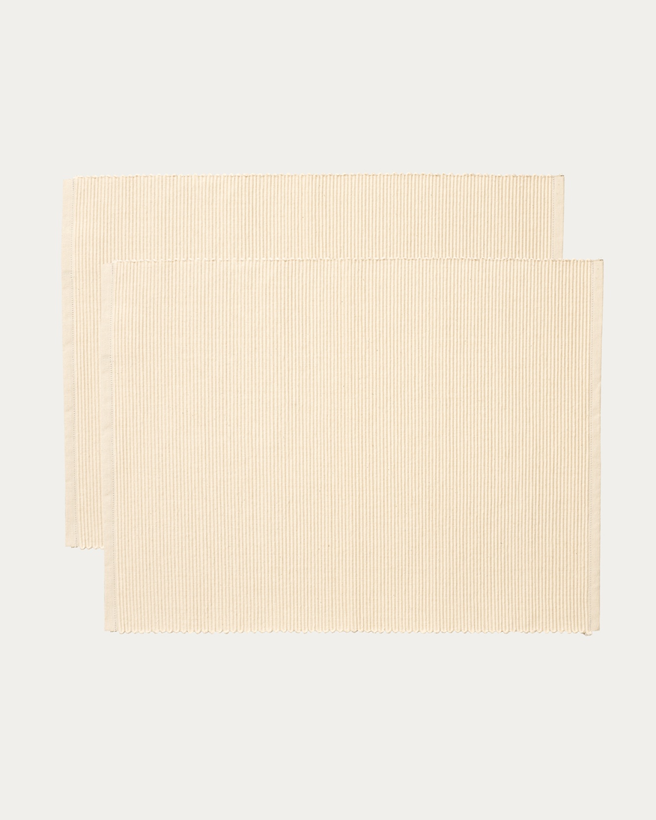 Product image creamy beige UNI placemat made of soft cotton in ribbed quality from LINUM DESIGN. Size 35x46 cm and sold in 2-pack.