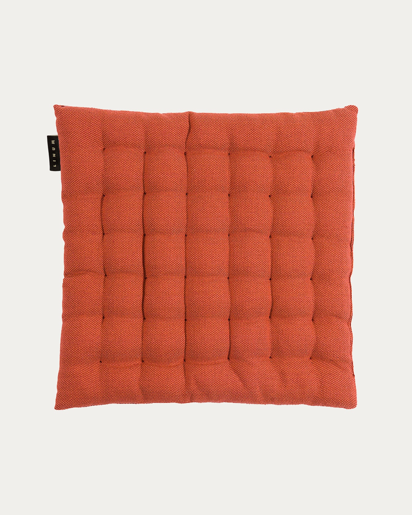 Product image rusty orange PEPPER seat cushion made of soft cotton with recycled polyester filling from LINUM DESIGN. Size 40x40 cm.